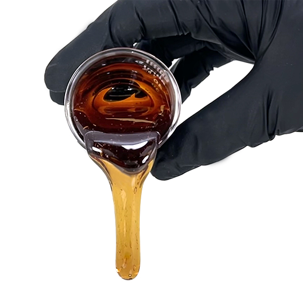 CBN Crystal Resistant Distillate - High Minors is poured from a lab beaker demonstrating its low viscosity through out it year long shelf life. CBN CRD is a amber CBN Oil ideal for vapes, gummies, tinctures and more. 